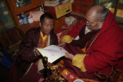 H.H. Dharma King Omniscience Achuk Lama stamps his second fingerprint onto the recognition letter he wrote recognizing the identity of H.H. Dorje Chang Buddha III