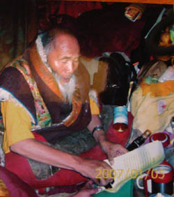 Dharma King Ngagwang Pedma Namgyal Palzangpo stamps his dharma king seal onto the congratulatory letter he wrote to H.H. Dorje Chang Buddha III