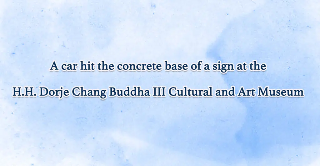 A-car-hit-the-concrete-base-of-a-sign-at-the-H.H.-Dorje-Chang-Buddha-III-Cultural-and-Art-Museum